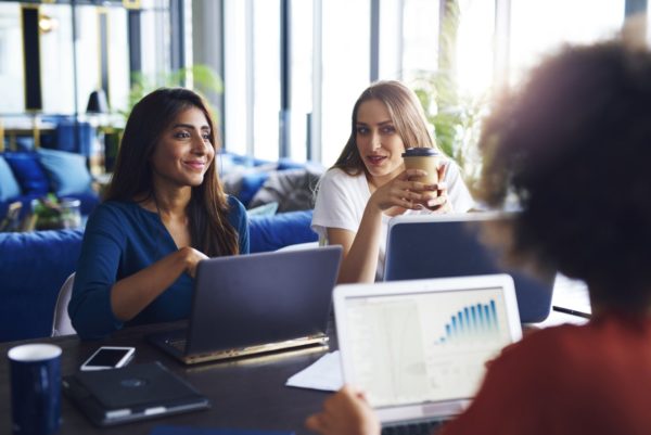 Young adults coworkers having business meeting